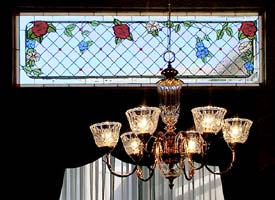 installed stained glass and  chandelier