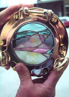 shell in brass porthole